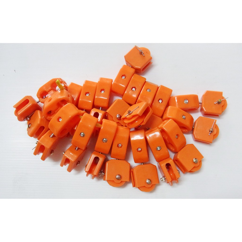 รอกพลาสติก ลูกล้อจับสายไฟ  รอกจับสายไฟ (สีส้ม) ขนาด 1/2 (4 หุน)